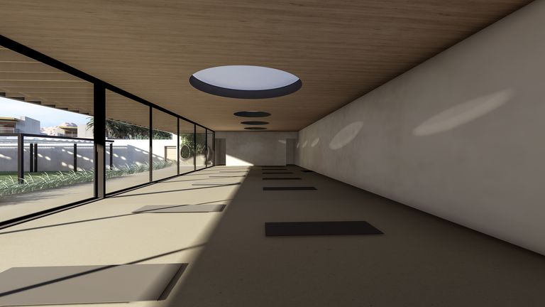 Rendering of an indoor studio at Civana Retreat: a long room with yoga mats, round skylights and a glass wall onto the garden